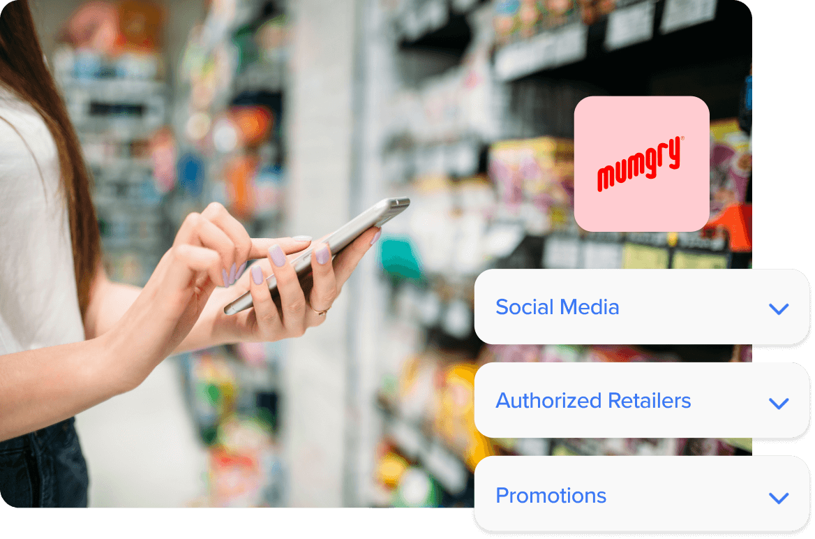 Woman looking up products on her iPhone while at the grocery store